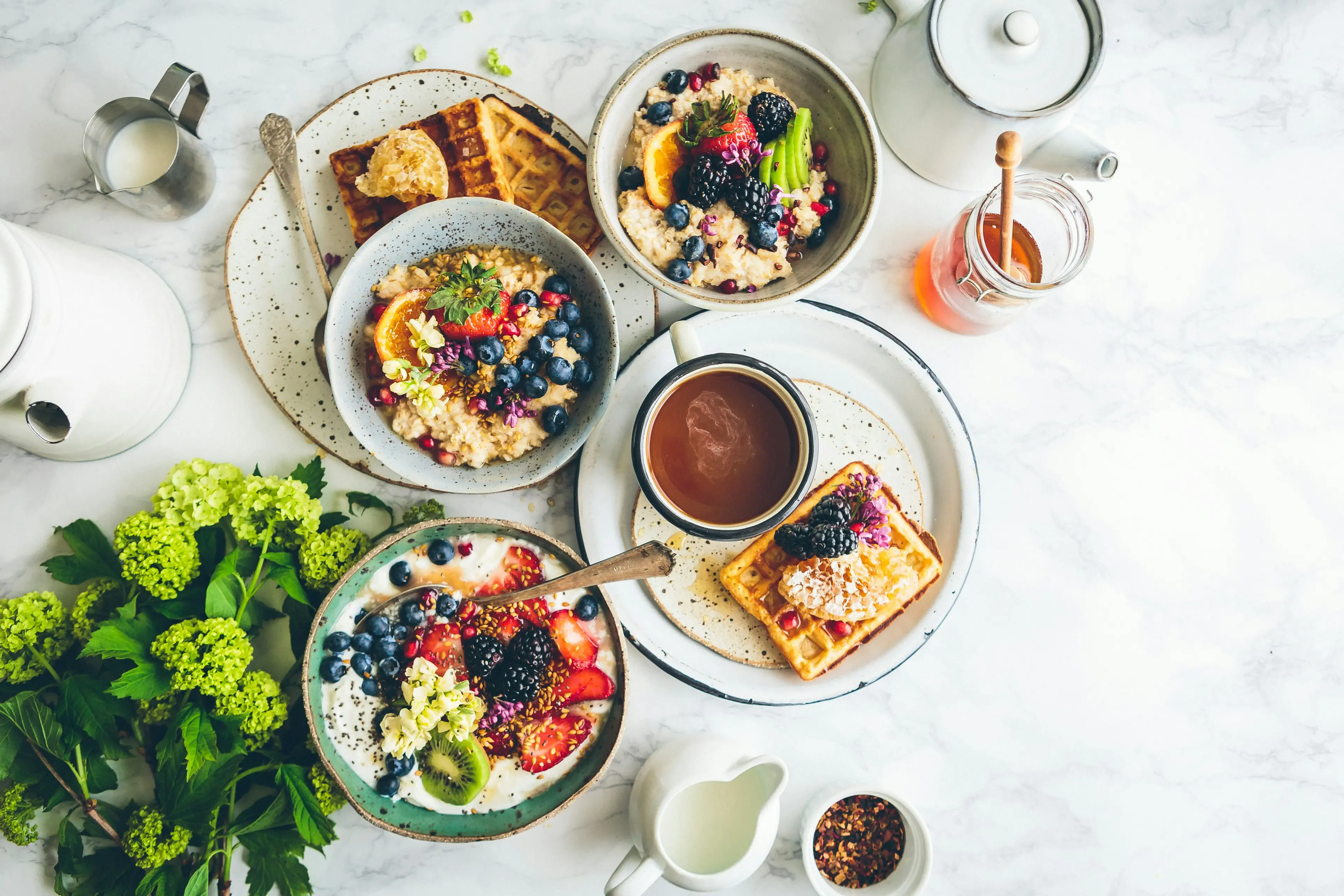 Sweet spread with waffles, berries, and coffee