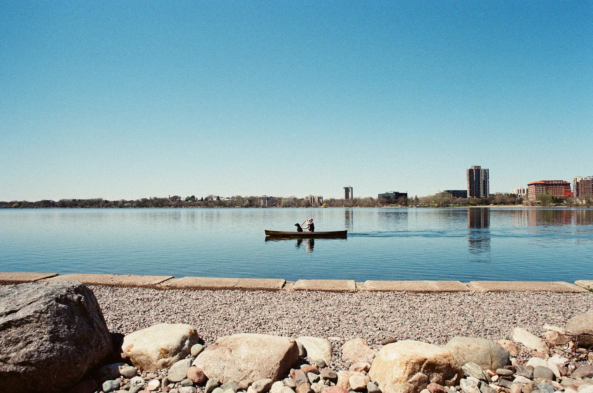 Bde Maka Ska lake view from the east shore with Minneapolis skyline in the background