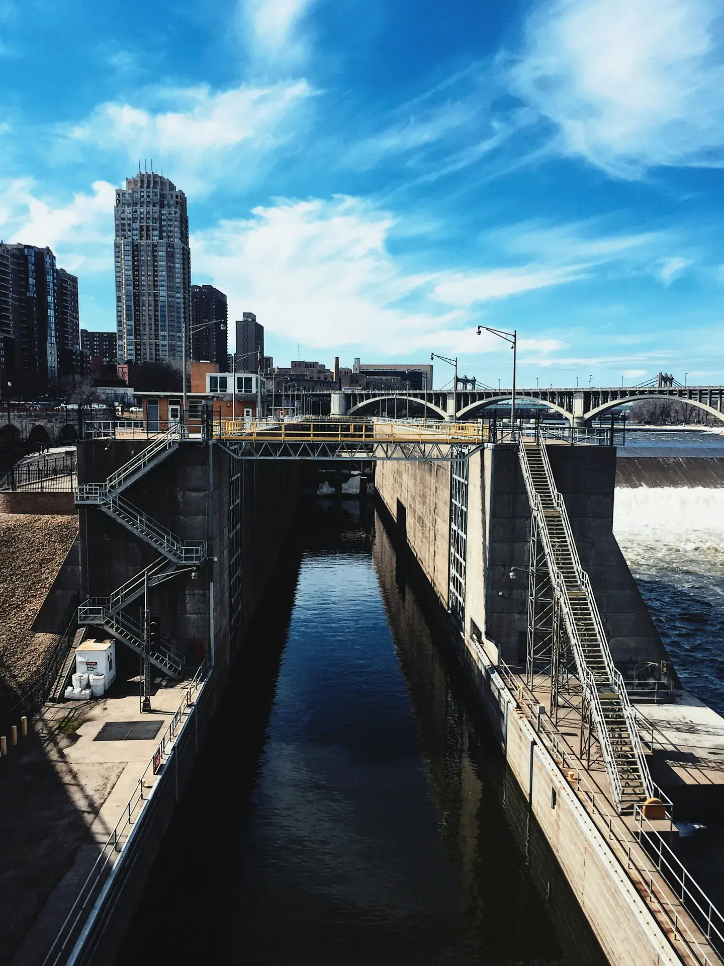 The Mississippi River bluffs and residential streets of Marcy Holmes in Southeast Minneapolis, with the downtown skyline in the background