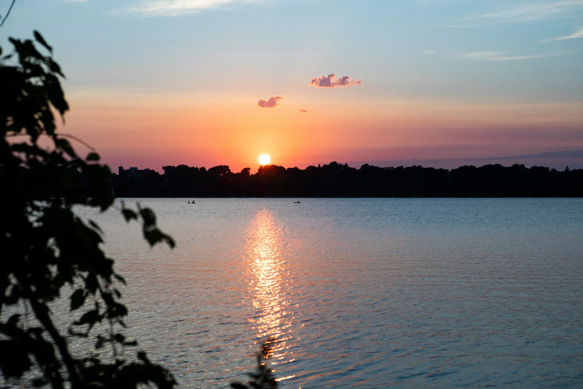 Lake Harriet shoreline seen from Linden Hills with the Minneapolis skyline in the distance